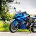2024 Suzuki GSX-8R static shot of the bike with a hedgerow backdrop