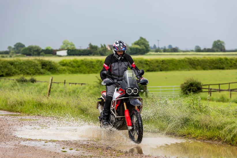 Ducati DesertX Rally ridden through a muddle puddle; muddle