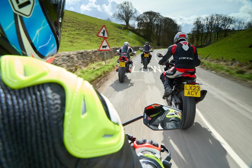Group of motorcyclists riding on UK road