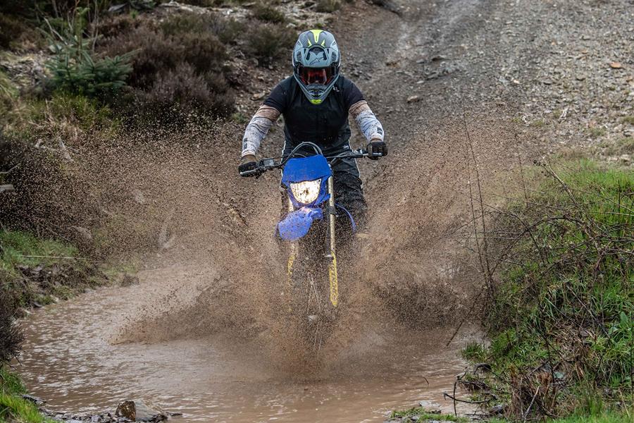 Yamaha WR450F ridden off-road through puddle