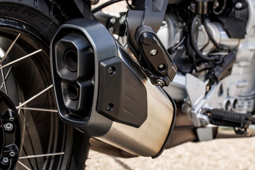 A detailed shot of the 2024 Moto Guzzi Stelvio's exhaust and  right hand side