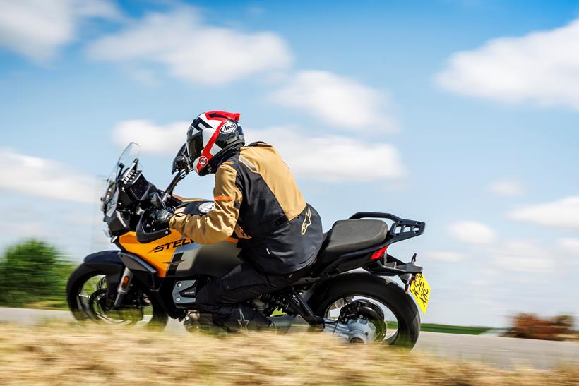 A ride by shot of the 2024 Moto Guzzi Stelvio