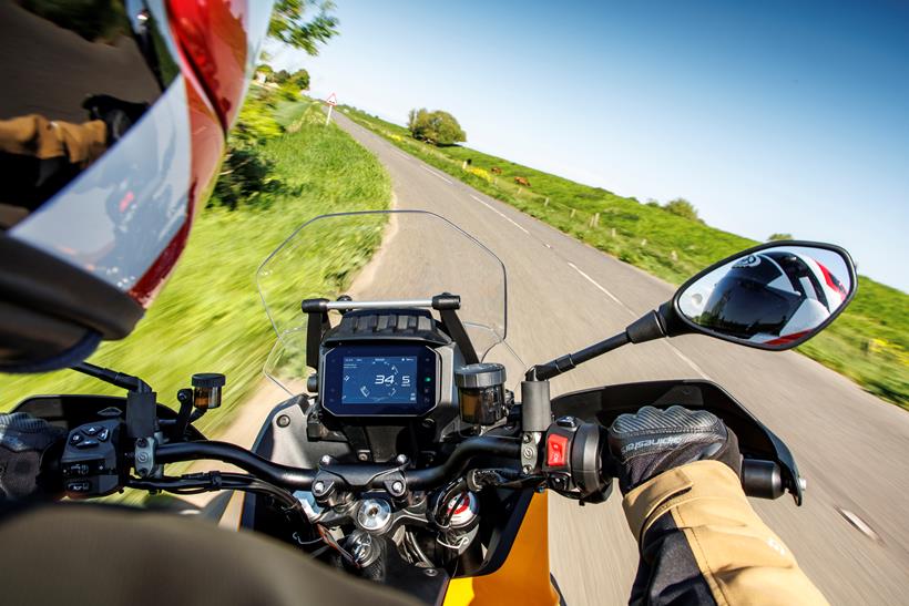 An onboard riding shot of the 2024 Moto Guzzi Stelvio's cockpit