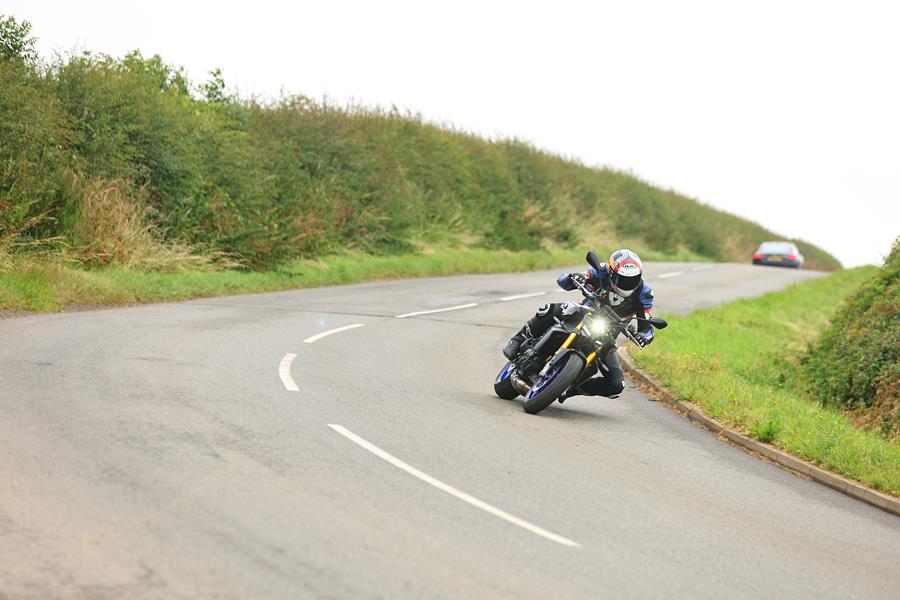 2024 Yamaha Mt-09 SP taking a bend on a country road