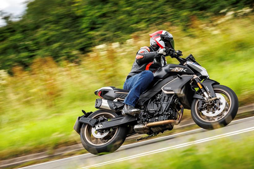 2024 CFMoto 800NK Advanced cornering on a country road