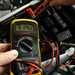 Checking motorcycle battery with a multimeter