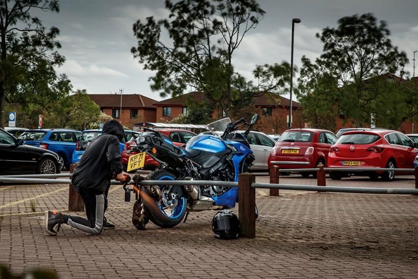 Thief cutting lock off of bike