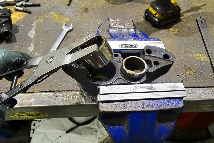 Using a tool to remove brake caliper piston safely