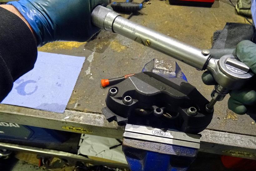 Using a torque wrench to re-fit brake caliper bolts