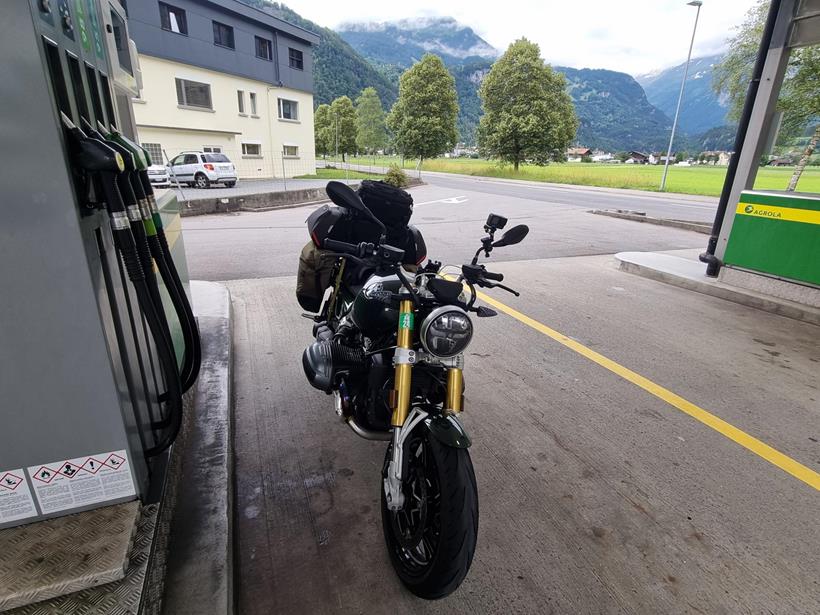 A fuel stop during Saffron's epic trip on the BMW R12 NineT