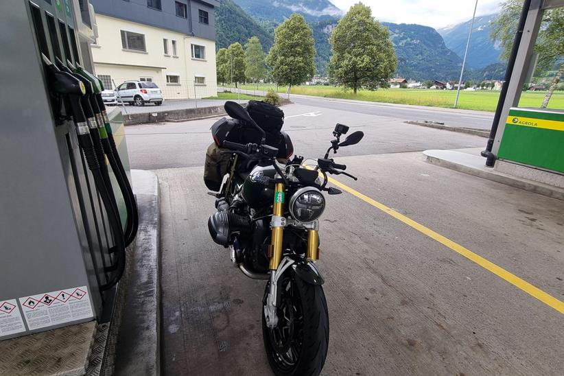 A fuel stop during Saffron's epic trip on the BMW R12 NineT