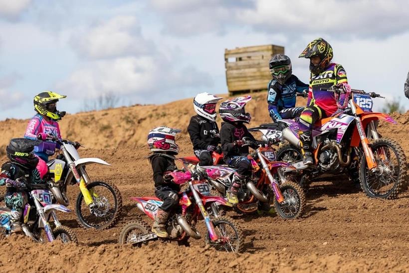 Lauren Collingwood on track teaching a cohort of young riders