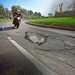 Motorcyclist approaching pothole