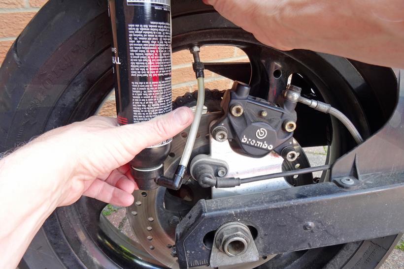 Using a can of Tyreweld to fix a motorcycle puncture