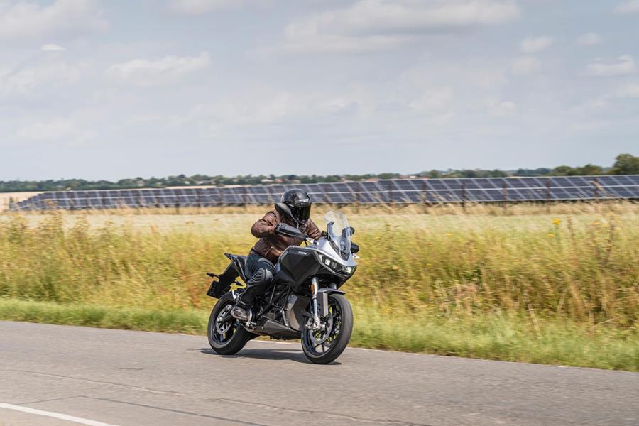 2024-on Zero DSR riding past a solar farm