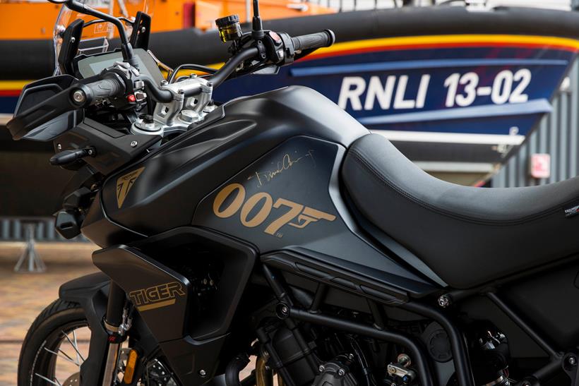 Special edition Triumph Tiger parked in front of a life boat