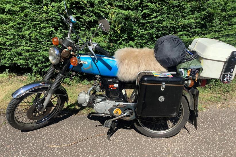 Honda SS50 moped with full luggage