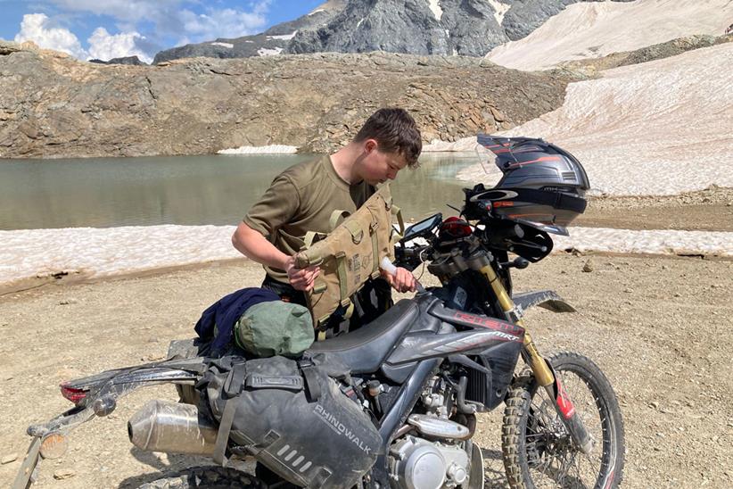 Luke Blackley adding fuel to his motorcycle