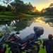 Udoh Ebaide Joy with her motorcycle overlooking lake