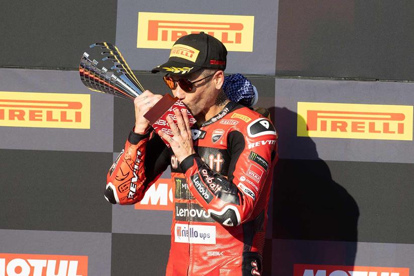 Alvaro Bautista celebrates on the podium at Portimao.