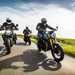 Three motorcyclists riding together