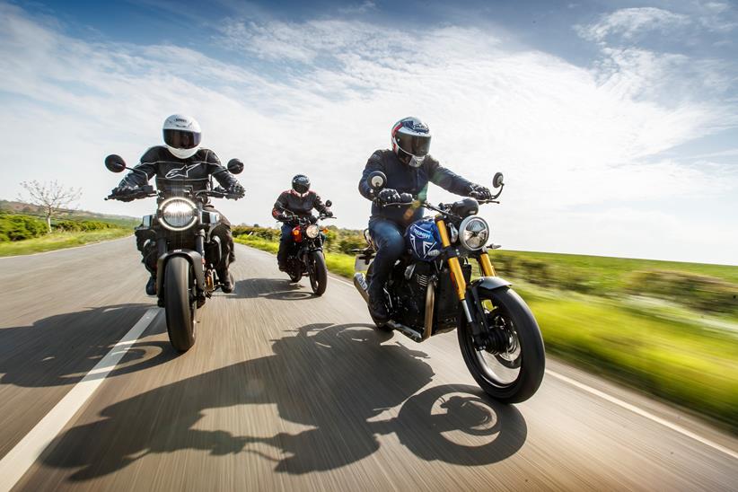 Three motorcyclists riding together