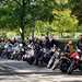 Motorcyclists lined up at side of road