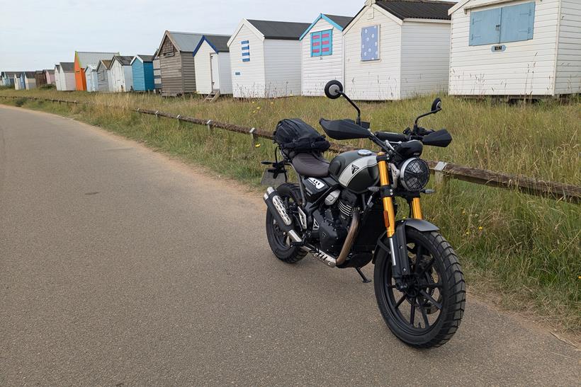 Triumph Scrambler 400 X with beach huts