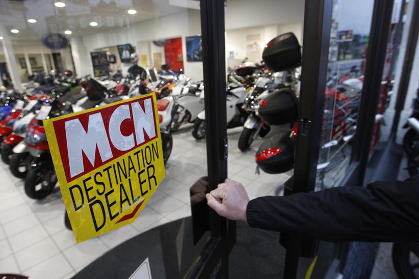 Person walking into motorcycle dealership