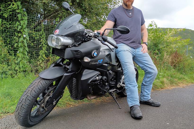 Rider sat on a BMW motorcycle wearing Roadskin Tyrian Jeans 