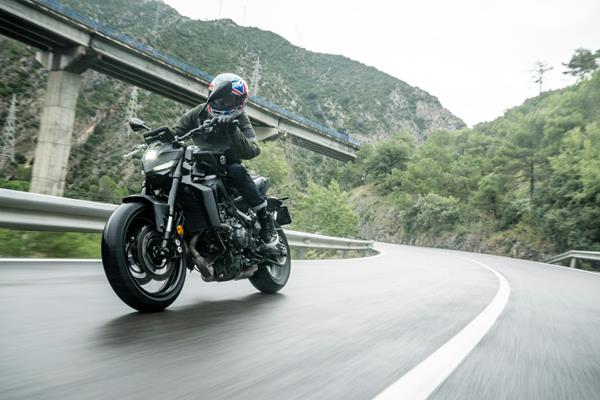 2024-on Yamaha MT-09 Y-AMT cornering on a country road