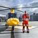 Man standing next to helicopter