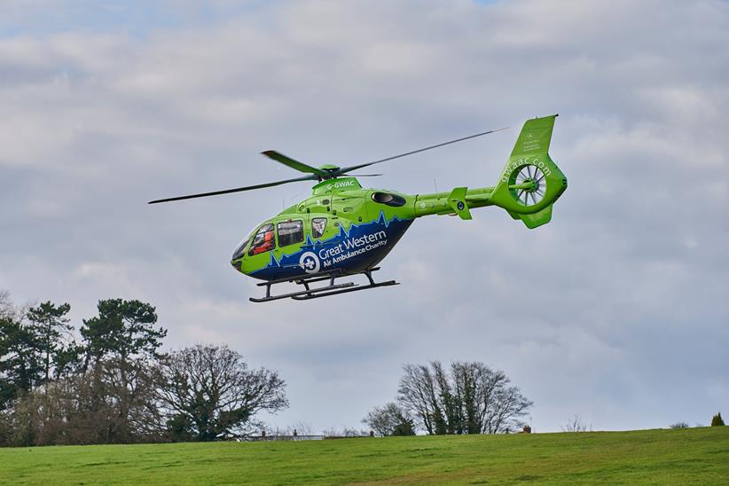 Air Ambulance helicopter landing on grass