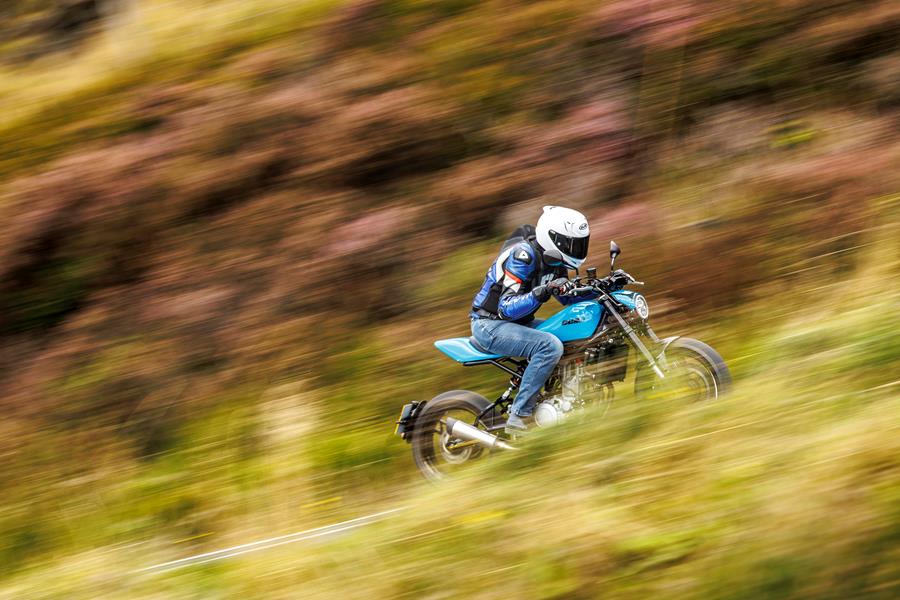 2025-on CCM Street Moto Core riding down a country road