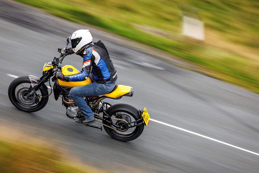 2025-on CCM Street Moto R riding down a country lane