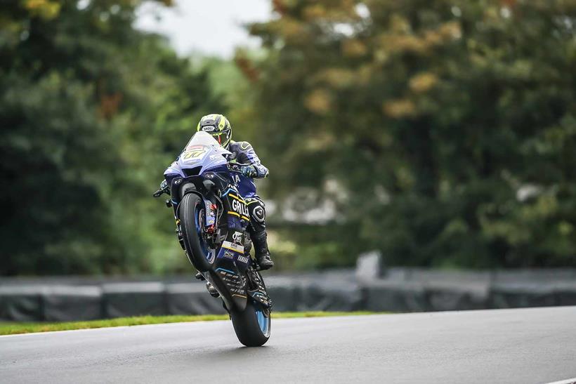 Kyle Ryde celebrates victory with a wheelie at Oulton Park