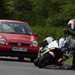 Motorcyclist picking up fallen BMW K1600 after accident