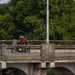 2025-on Can-Am Pulse crossing a city bridge