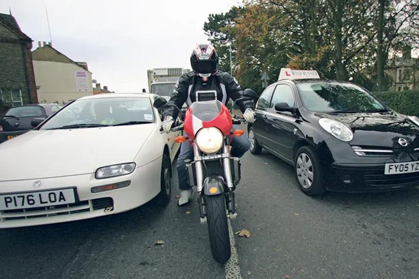 Rider filtering through traffic