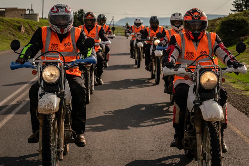 Riders for Health riders in convoy