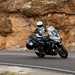 2025-on Kawasaki Versys 1100 SE cornering on a mountain road