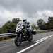 2025-on Kawasaki Versys 1100 SE riding on a gloomy day