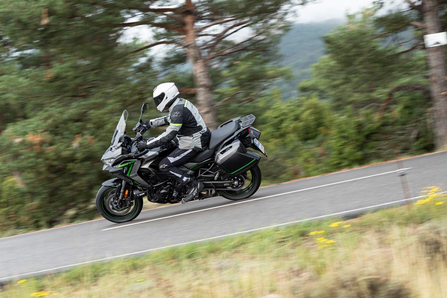 2025-on Kawasaki Versys 1100 SE riding through a forest