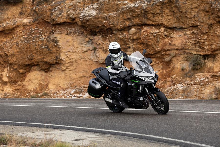 2025-on Kawasaki Versys 1100 SE cornering on a mountain road