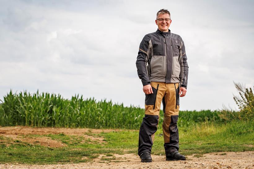 Full-body shot of Justin Hayzelden modelling the Fox Ranger textile jacket and trousers