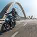 2025 Kawasaki Z900 riding over a bridge