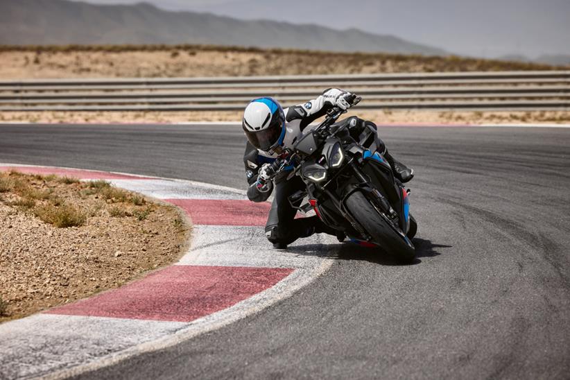 BMW M1000R cornering on track