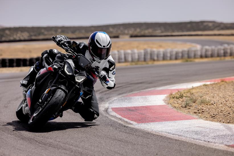 BMW M1000R cornering on track