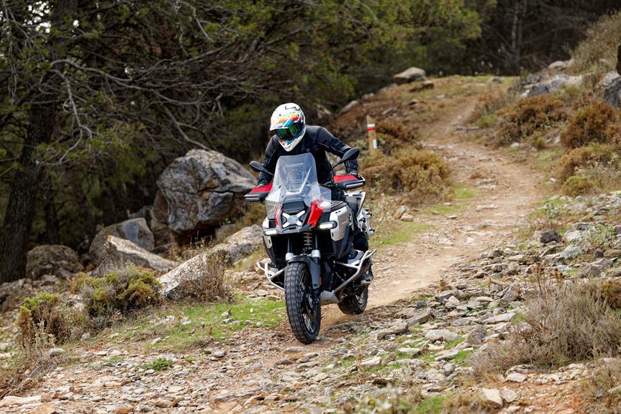 2024-on BMW R1300GS Adventure ASA riding off road towards the camera