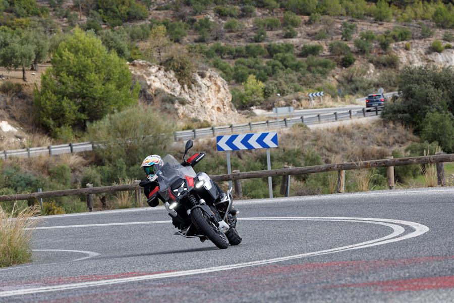 2024-on BMW R1300GS Adventure ASA leaning into a corner on the road